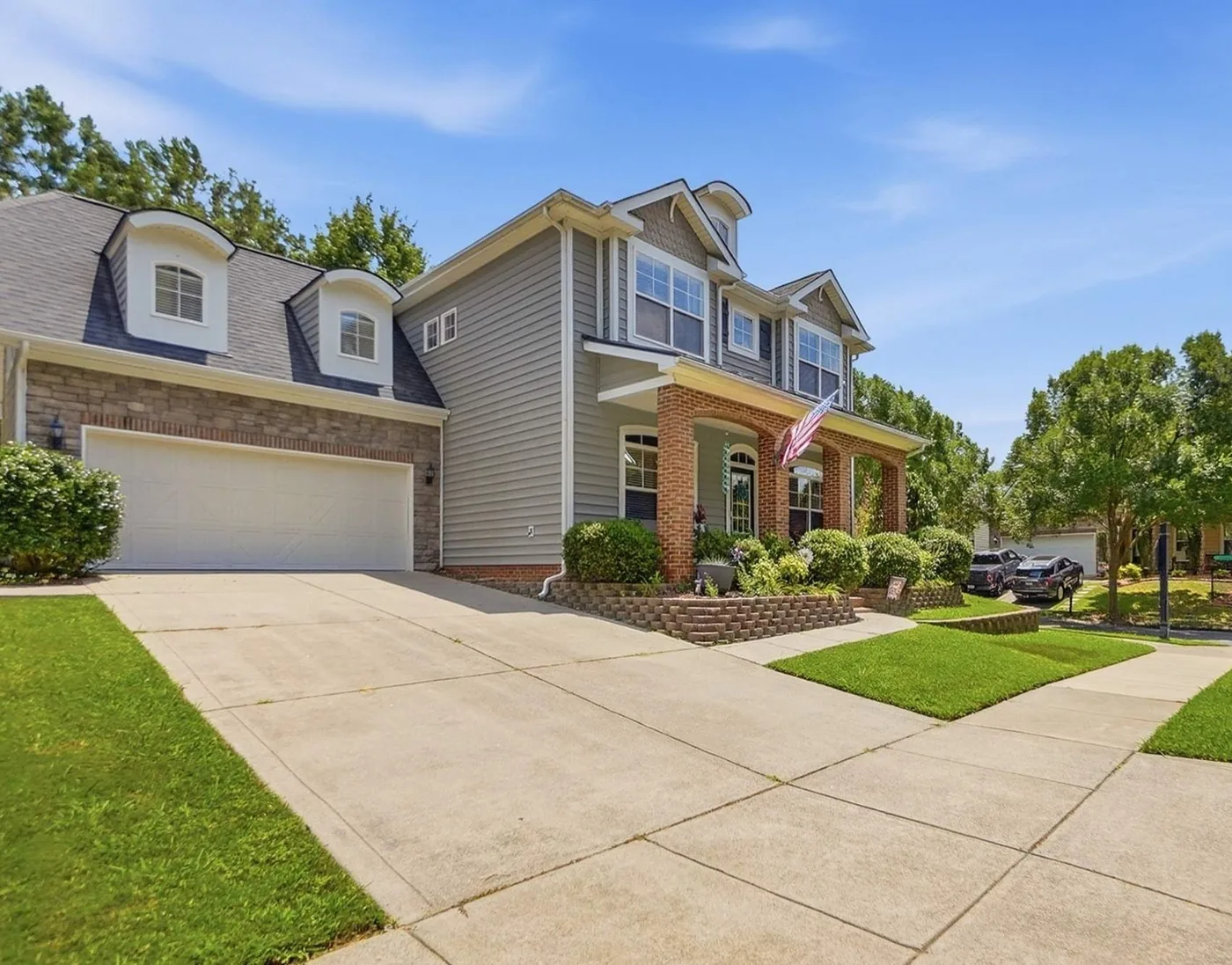 Selling 1 A two story brick and siding home with a front porch in cureton, waxhaw, nc, listed by the longleaf group